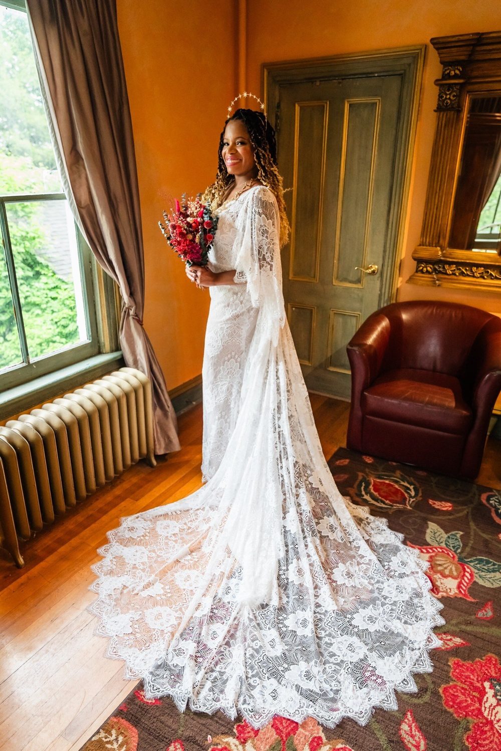 Adrienne's bride in a lace gown with a long train